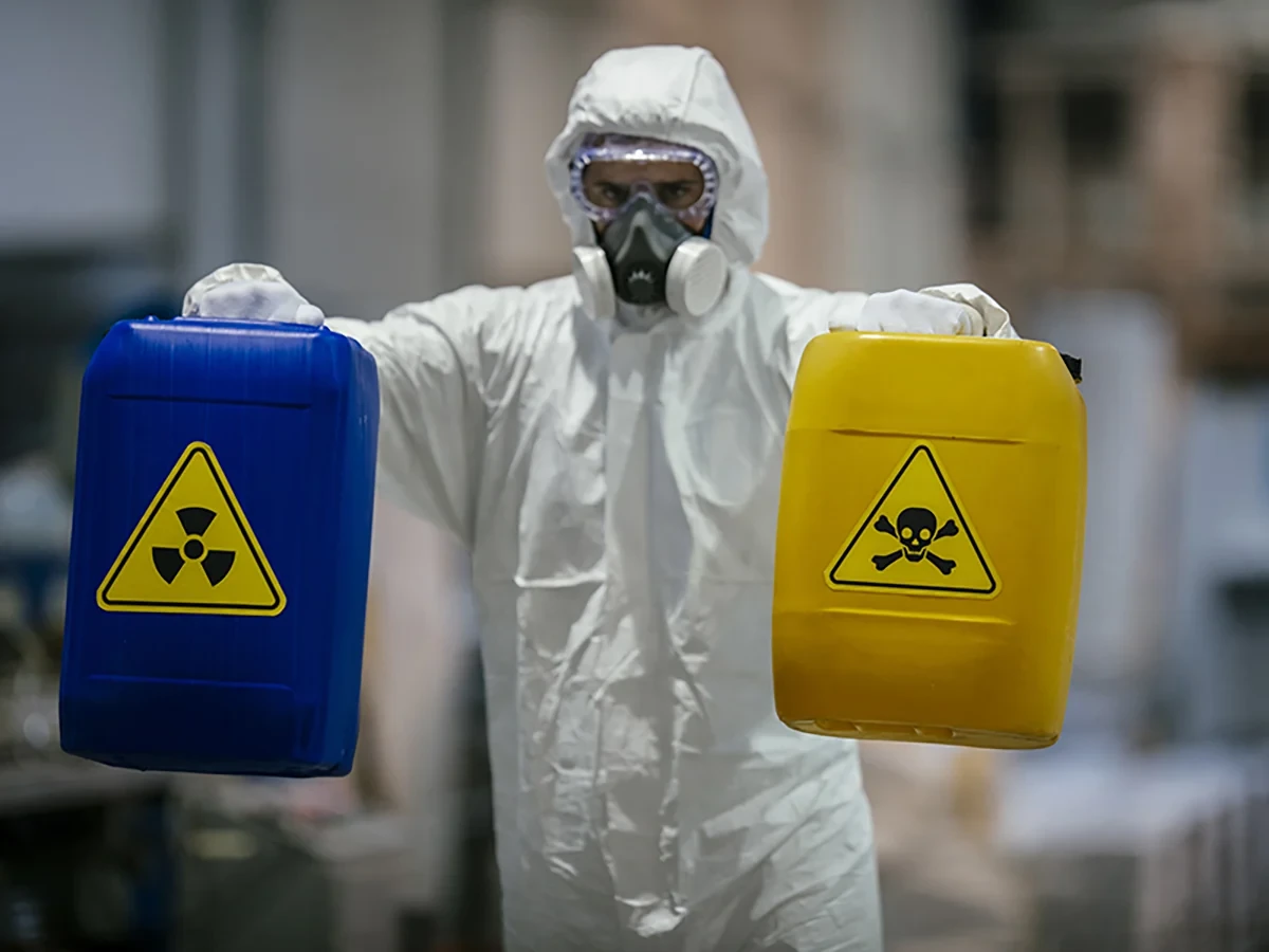 Biohazard cleanup technicians in protective equipment at a remediation scene in Arvada, CO